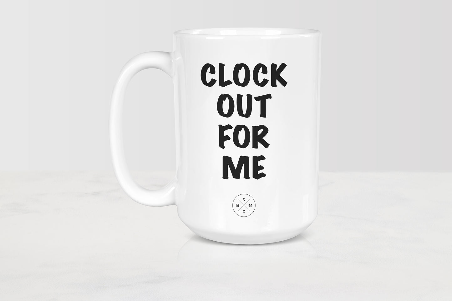 15 ounce white ceramic mug with black text clock out for me