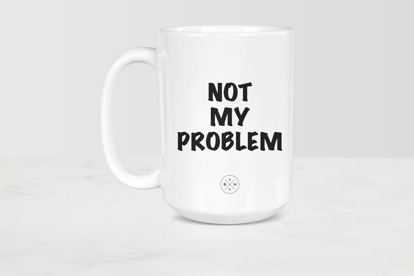 15 ounce white ceramic mug with black text not my problem