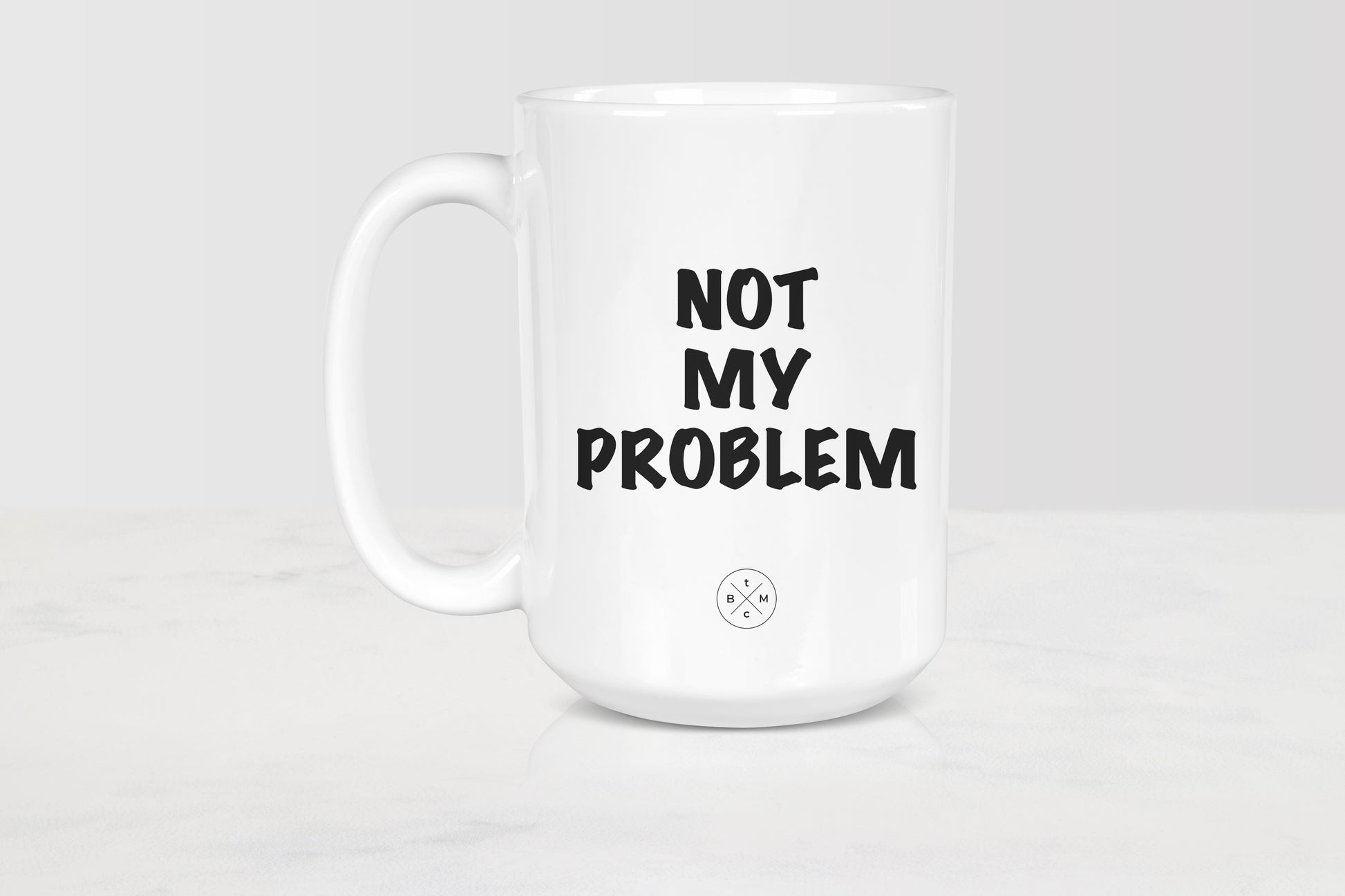 15 ounce white ceramic mug with black text not my problem