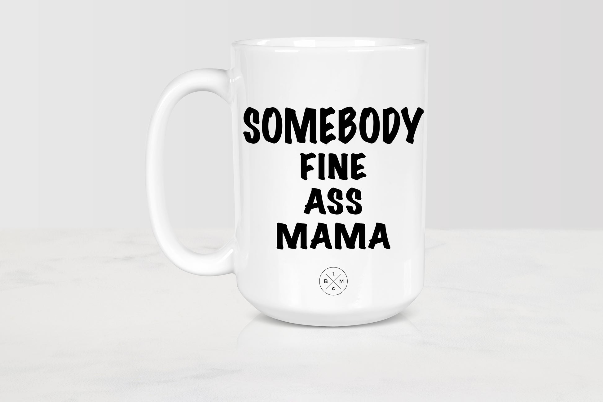 15 ounce white ceramic mug with black text somebody fine ass mama