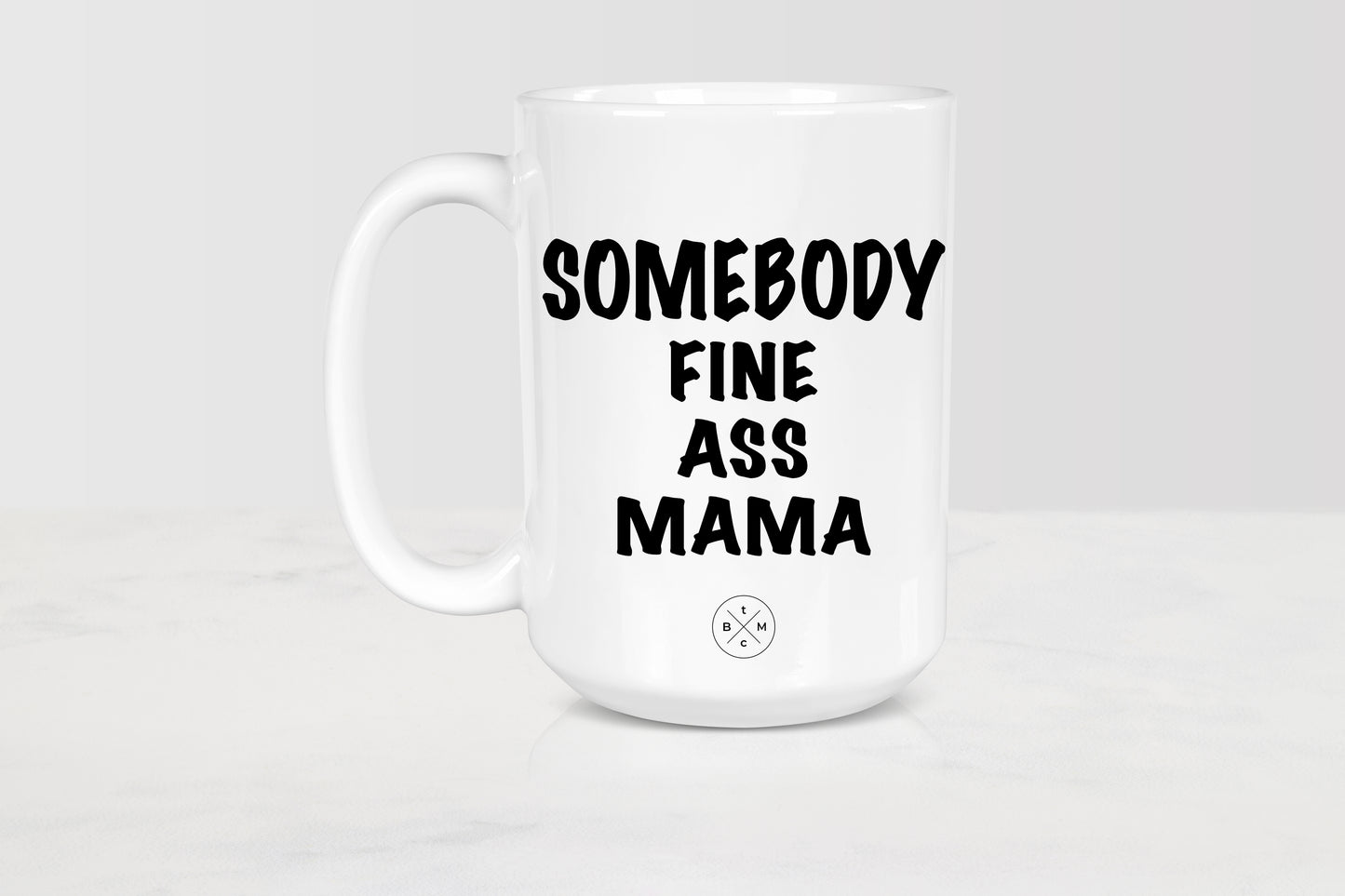 15 ounce white ceramic mug with black text somebody fine ass mama