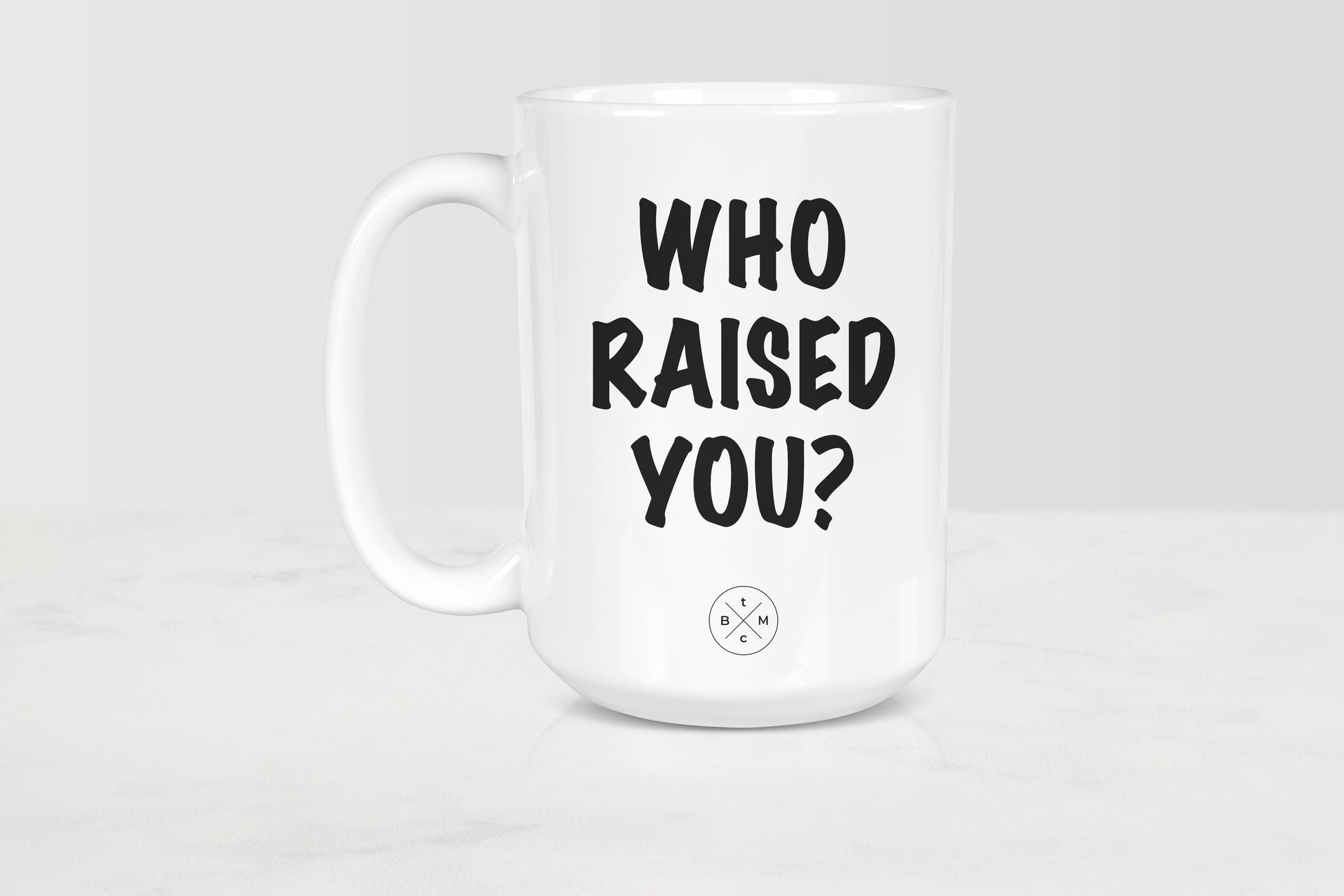 15oz white ceramic mug with black text who raised you?