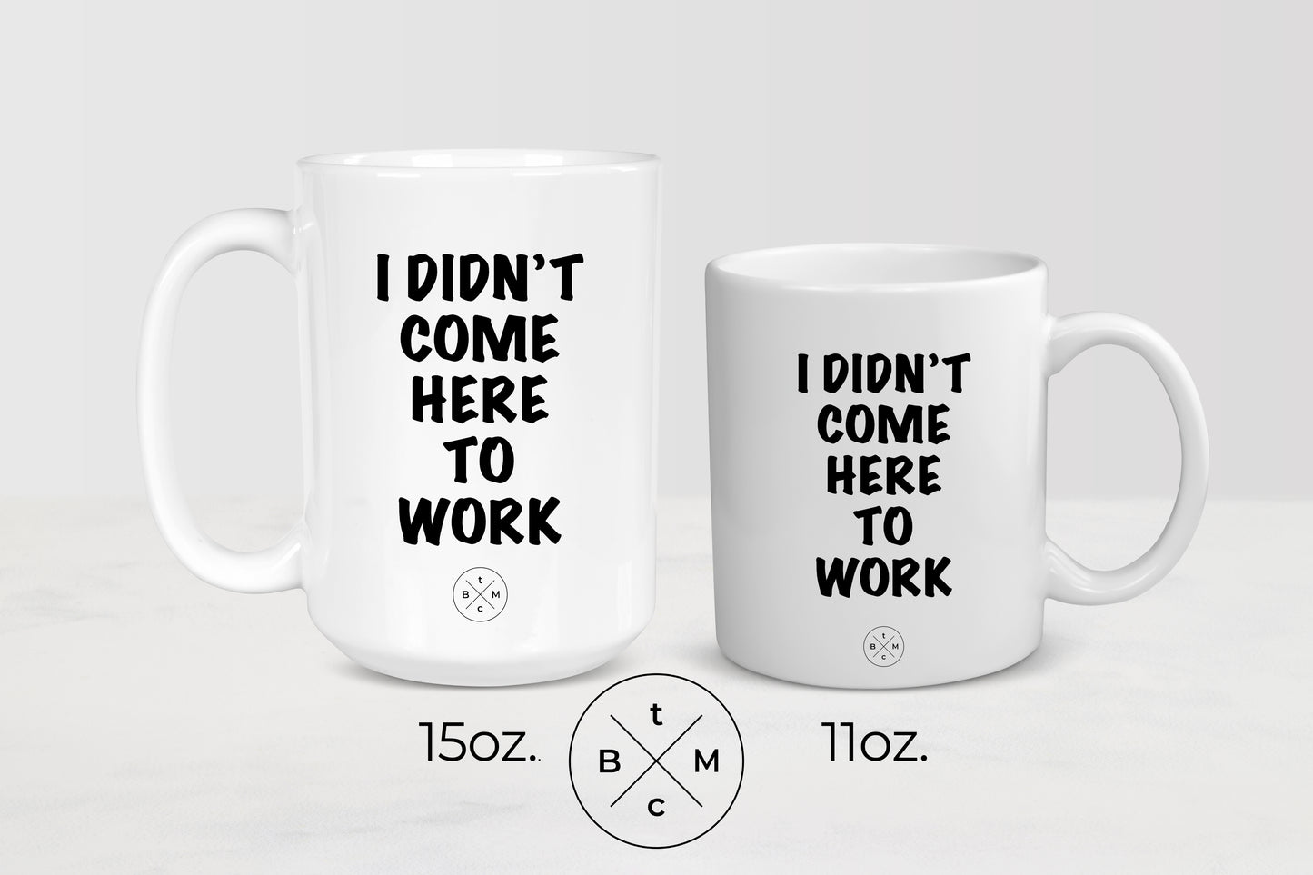 11 ounce and 15 ounce white ceramic mugs with black text I didn’t come to work