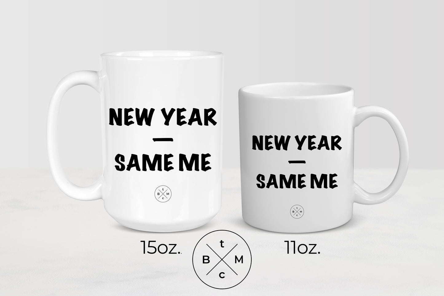 White 11 ounce an 15 ounce ceramic  mugs with black text new year same me