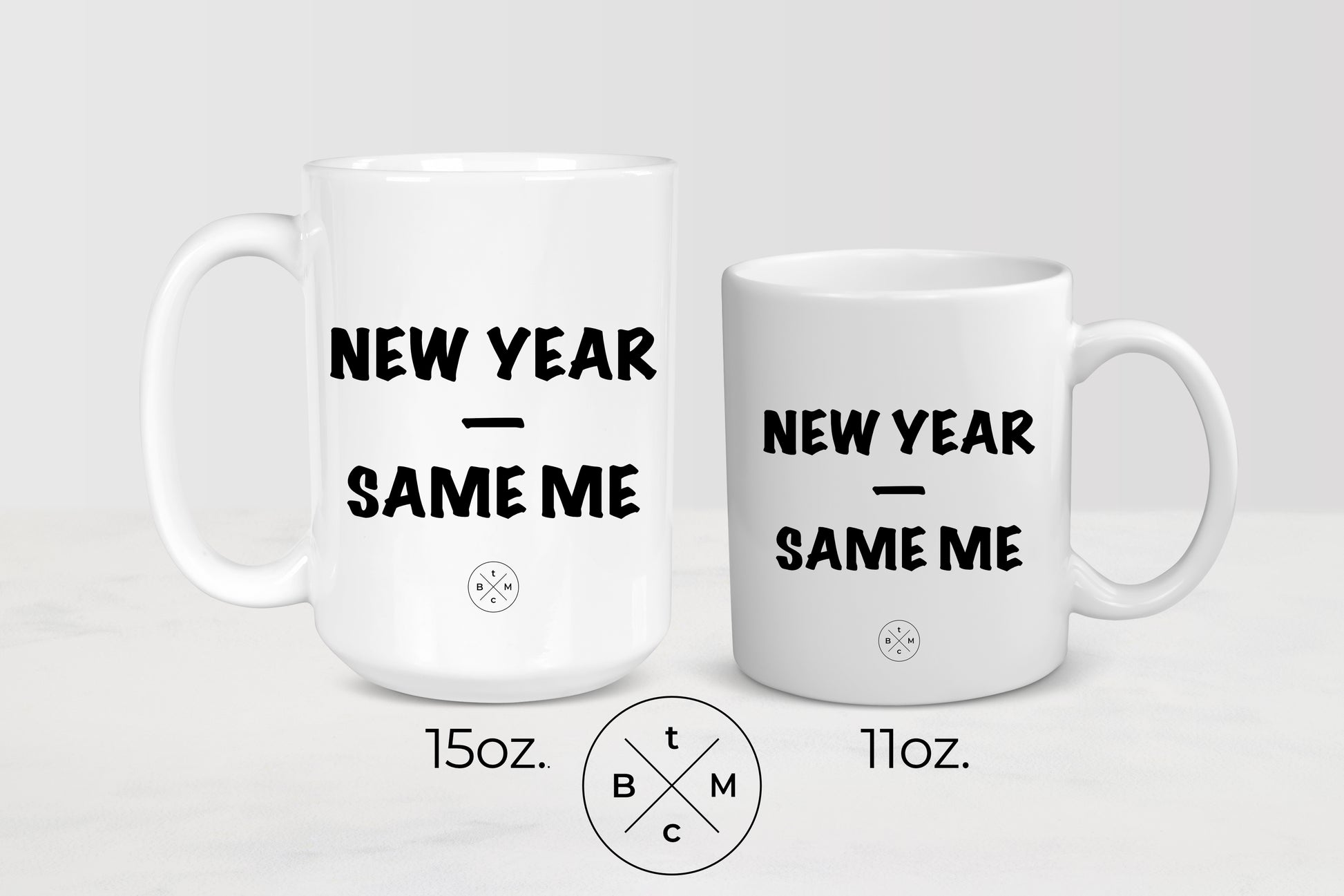 White 11 ounce an 15 ounce ceramic  mugs with black text new year same me