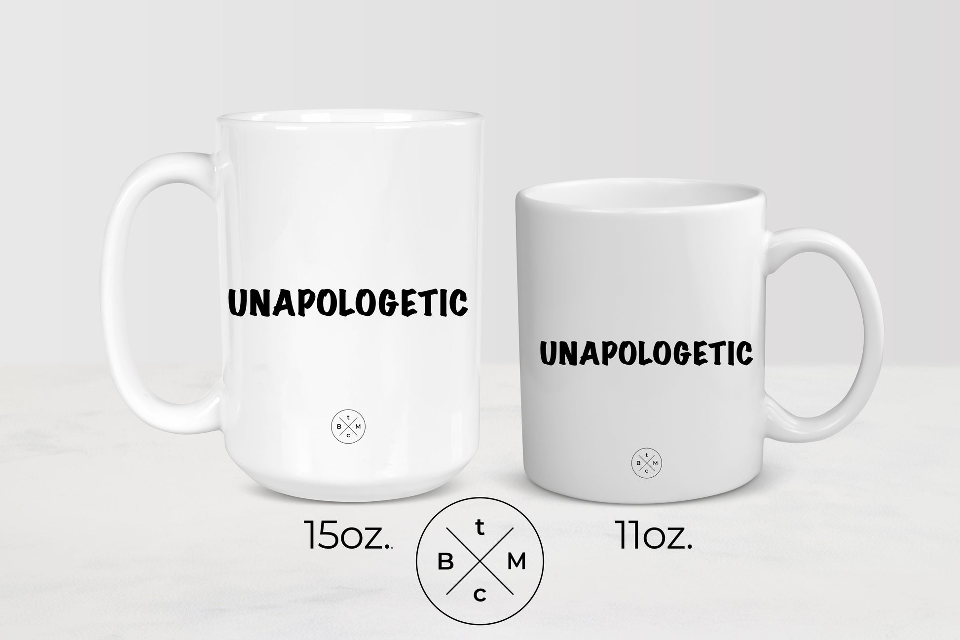 11 ounce and 15 ounce white ceramic mugs with black  text unapologetic