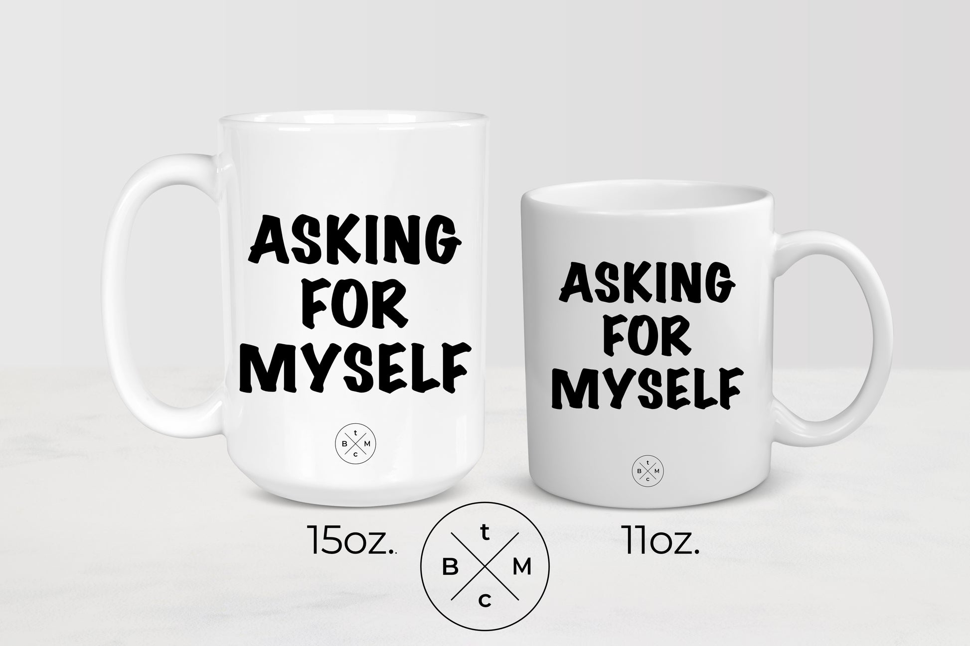 White 11 ounce and 15 ounce ceramic mugs with black text asking for myself