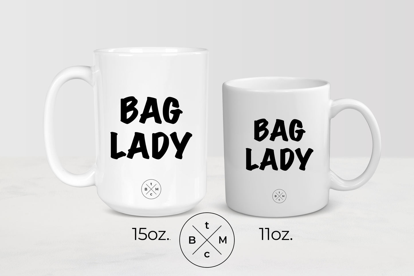 11 ounce and 15 ounce white ceramic mugs with black text bag lady