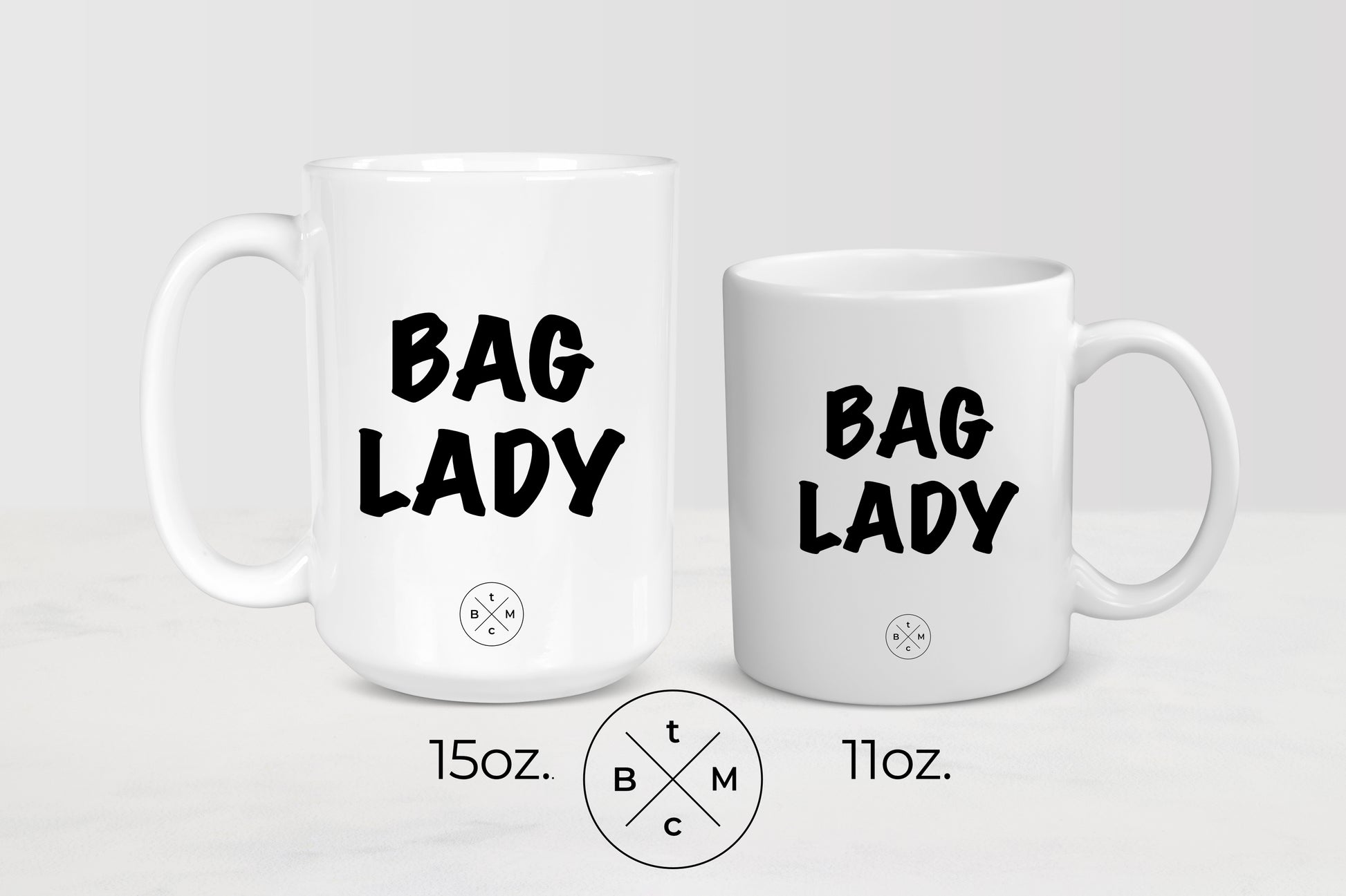 11 ounce and 15 ounce white ceramic mugs with black text bag lady