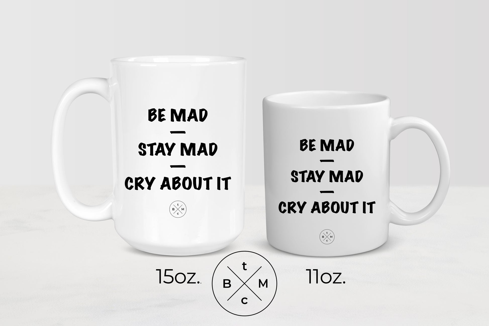 White 11 ounce and 15 ounce  ceramic mugs with black text be mad stay mad cry about it