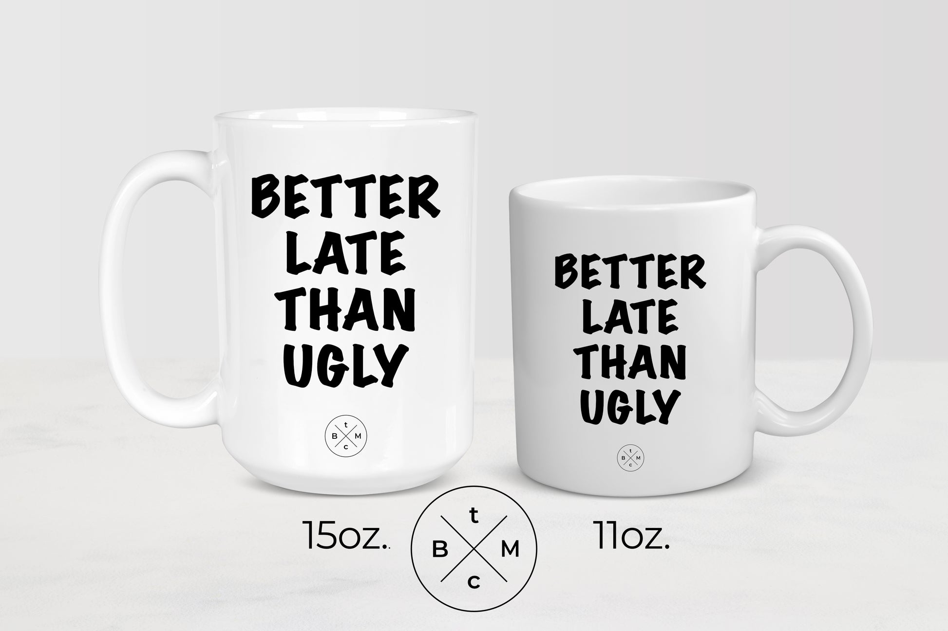 White 11 ounce and 15 ounce ceramic mugs with black text better late than ugly