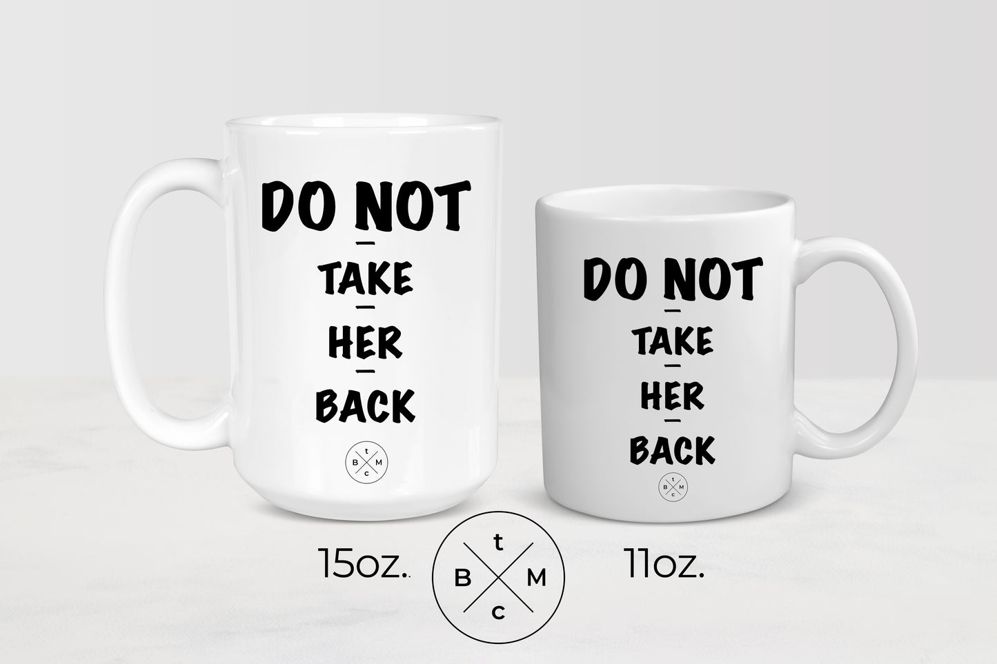White 11 ounce and 15 ounce ceramic mugs with black text do not take her back