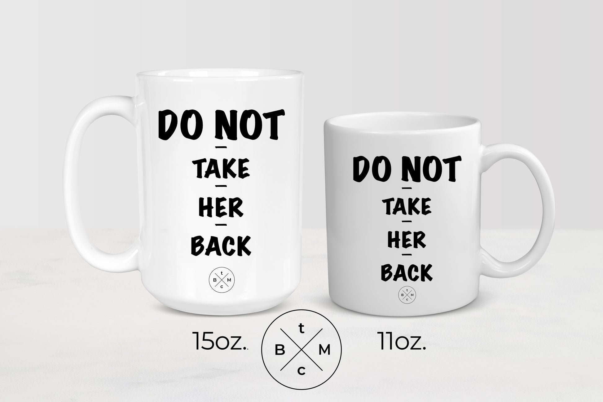 White 11 ounce and 15 ounce ceramic mugs with black text do not take her back