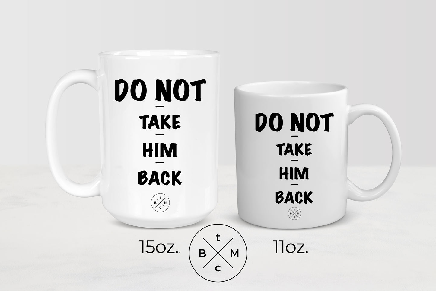 White 11 ounce and 15 ounce ceramic mugs with black text do not take him back