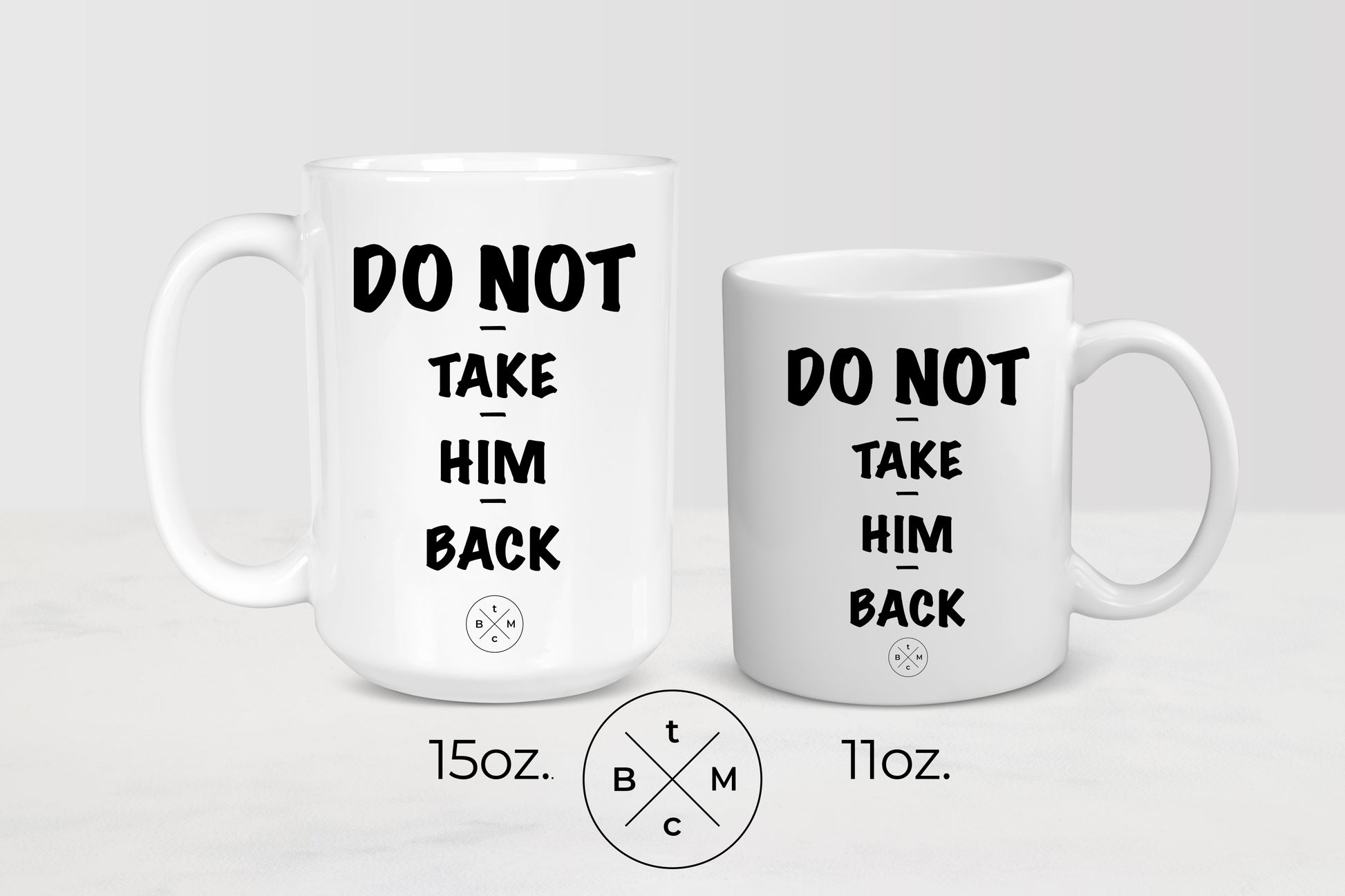 White 11 ounce and 15 ounce ceramic mugs with black text do not take him back