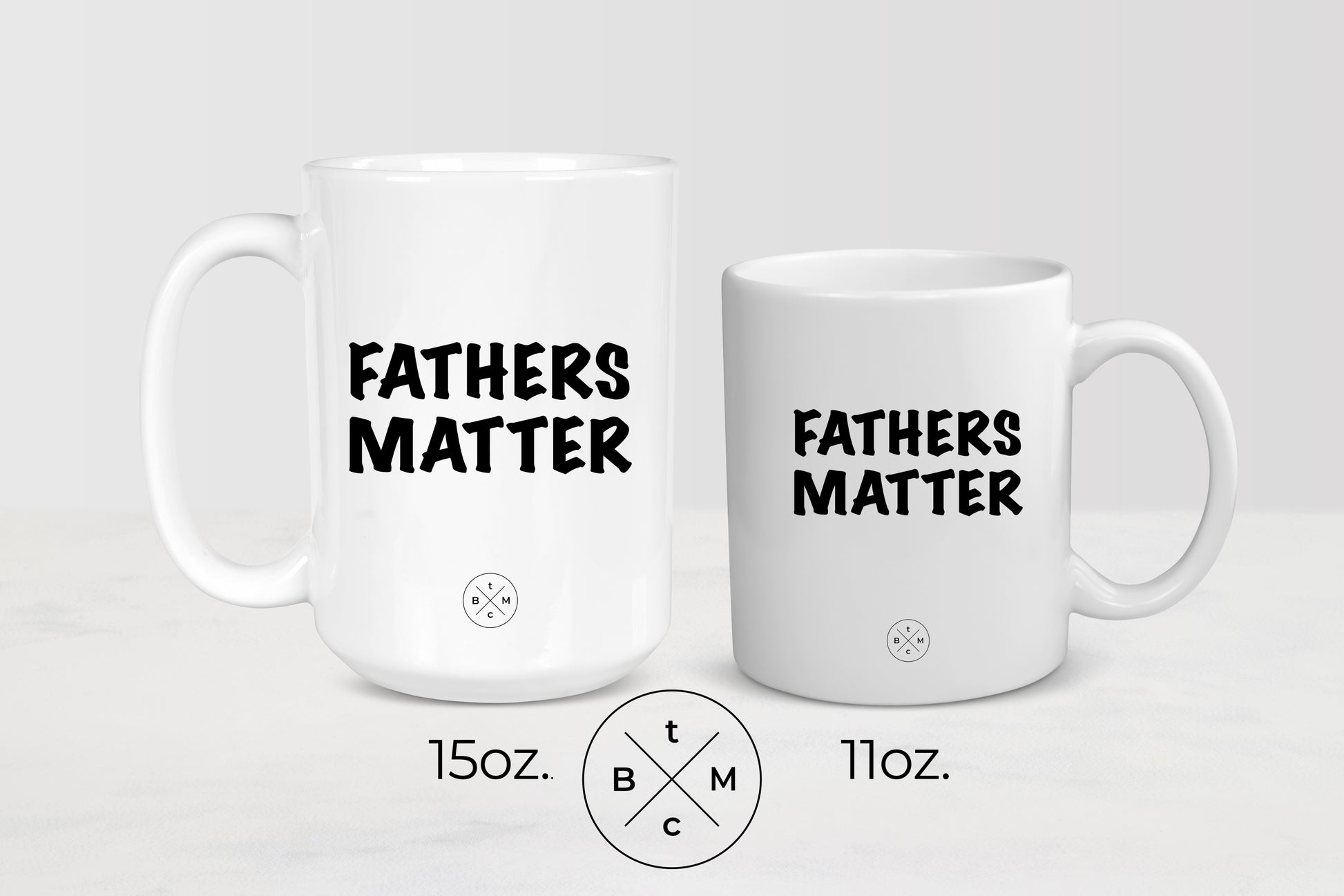11 ounce and 15 ounce white ceramic mugs with black text fathers matter