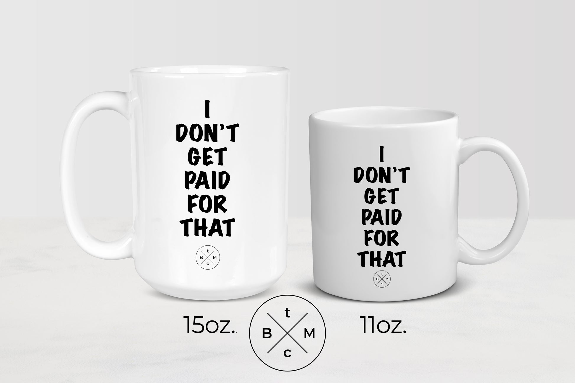 11 ounce and 15 ounce  white ceramic mug with black text I don’t get paid for that