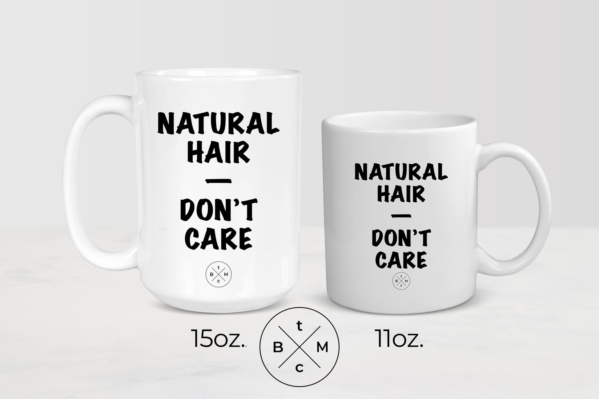 White 11 ounce and 15 ounce ceramic mugs with black text natural hair don’t care
