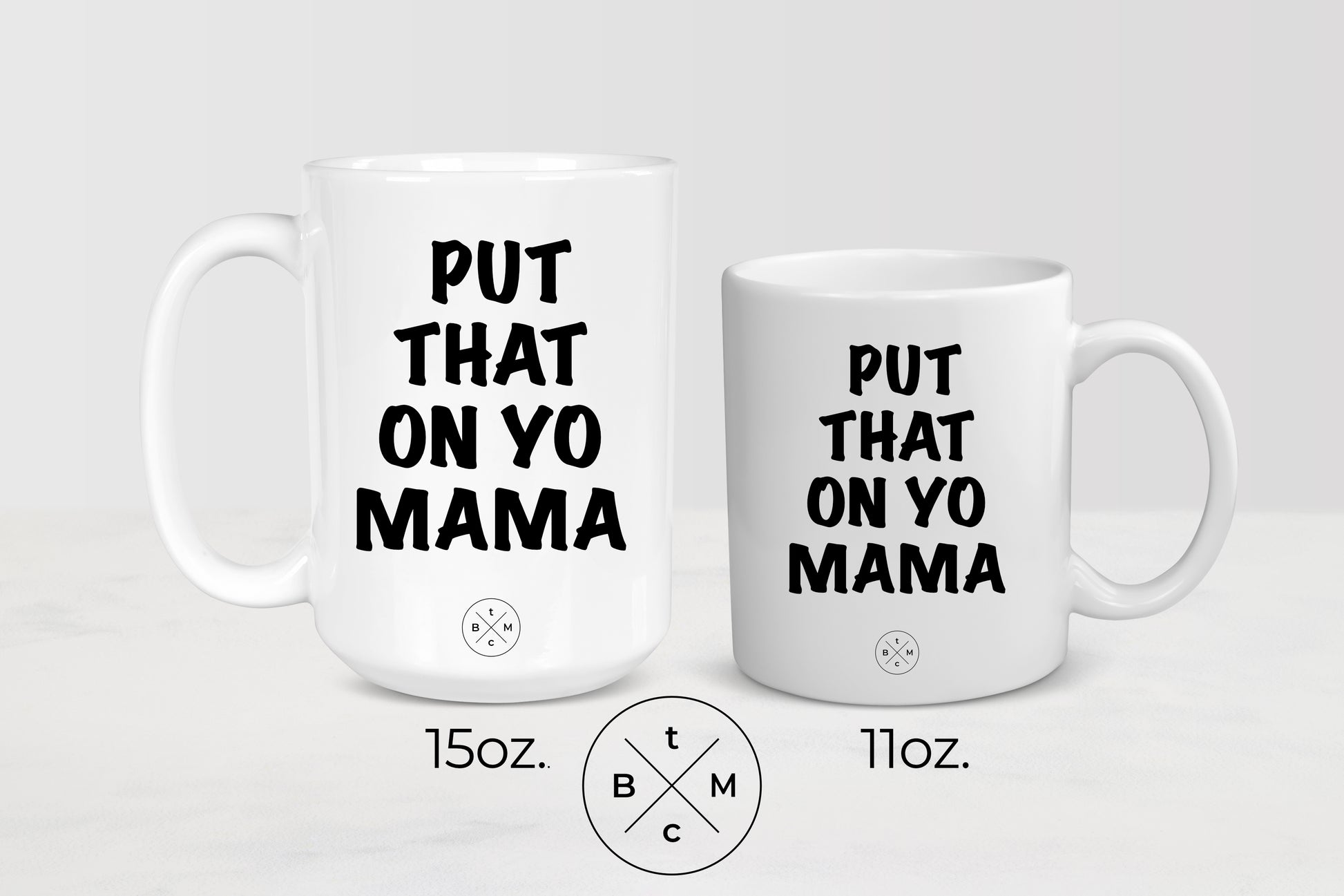 White 11 ounce and 15 ounce  mugs with black text put that on yo mama