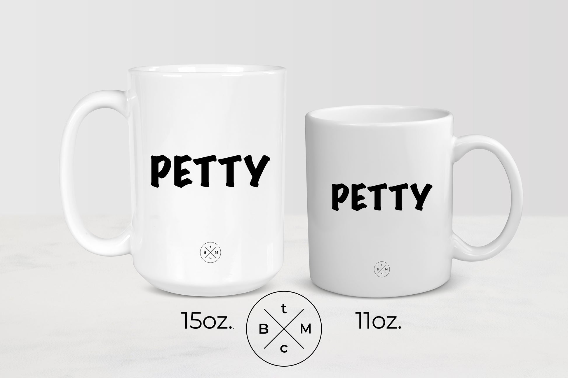 White 11 ounce and 15 ounce ceramic mugs with black text petty