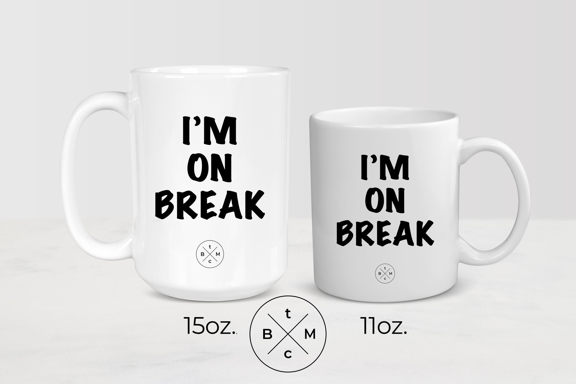 11 ounce and 15 ounce  white ceramic mugs with black text I’m on break