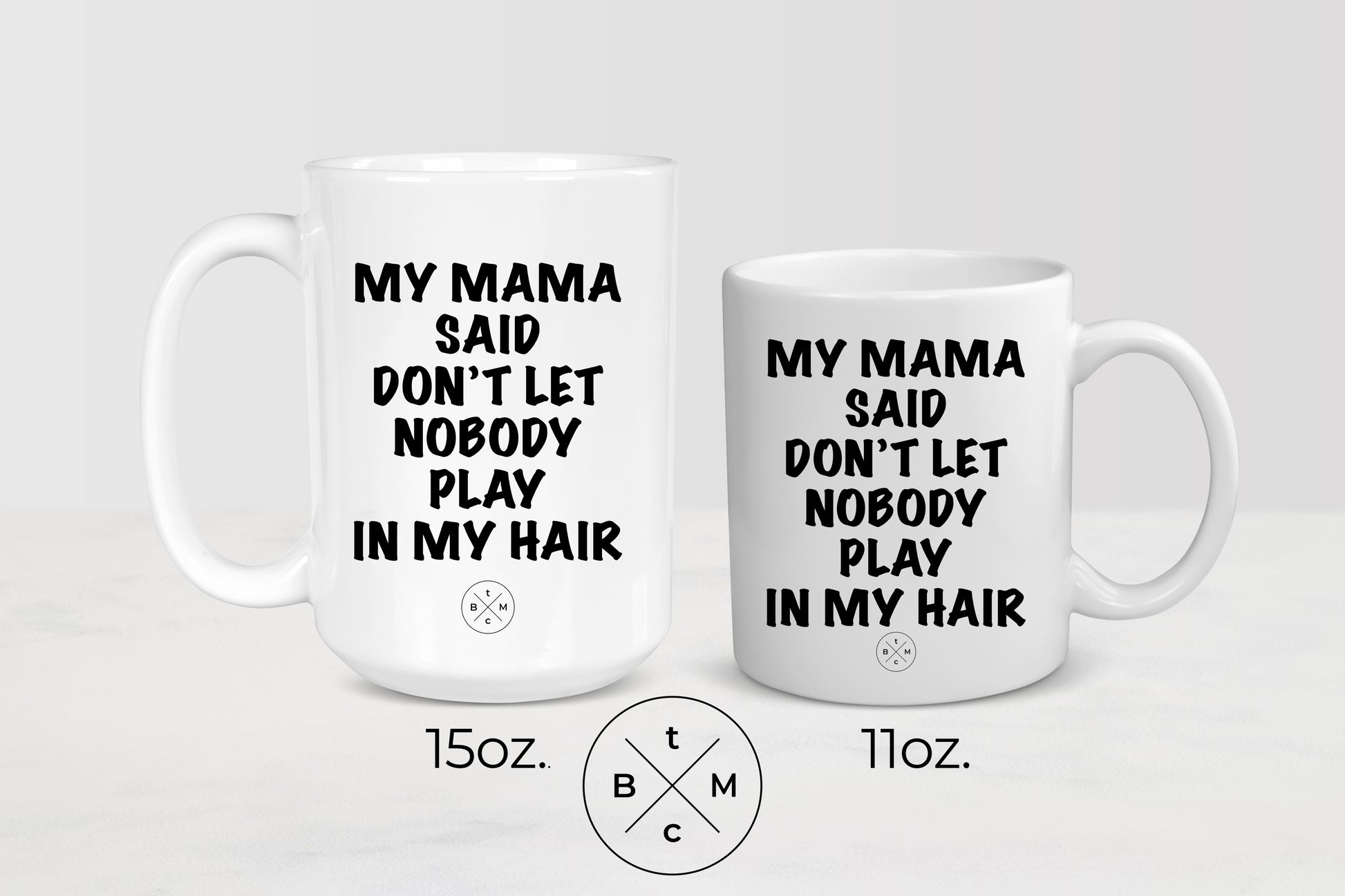11 ounce and 15 ounce white ceramic mugs with black text my mama said don’t let nobody playing my hair 